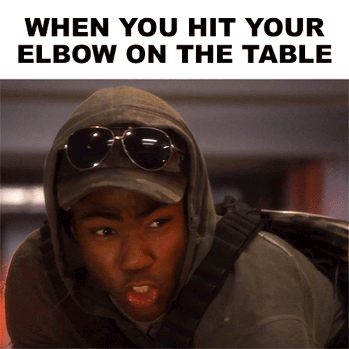 Man in Hoodie and Sunglasses When You Hit Elbow