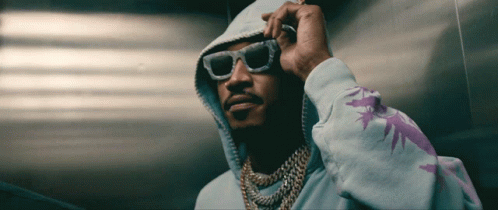Man in Hoodie and Sunglasses with Purple Leaf