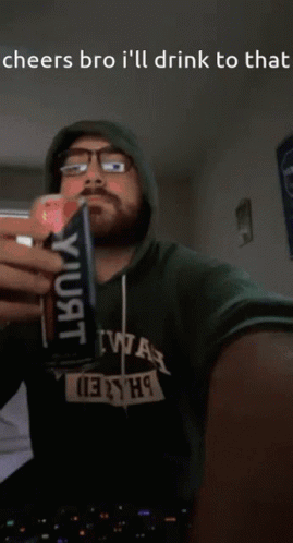 Man in Hoodie Drinking Can Cheers Bro I'll Drink to That