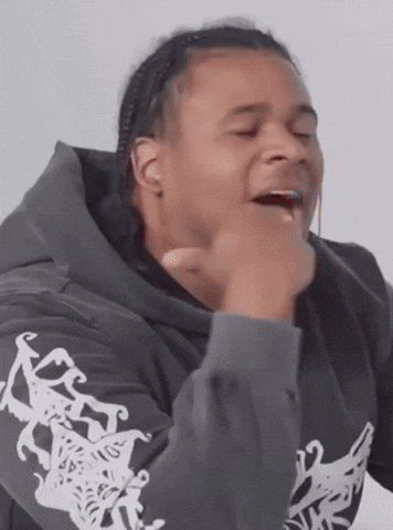 Man in Hoodie Making Funny Face With Hands on Chin