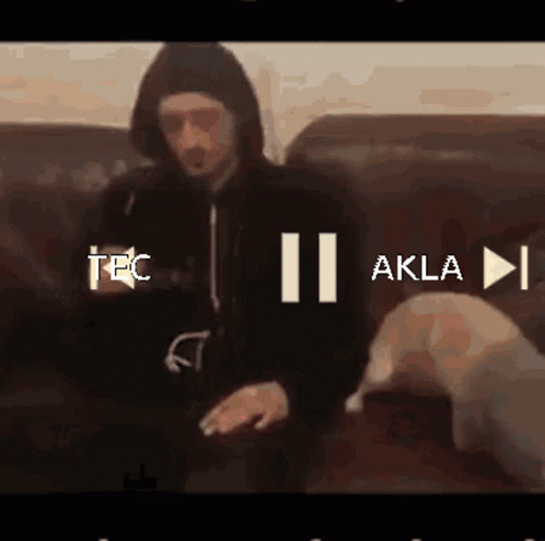 Man in Hoodie Sitting on Couch Tec II Akla