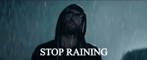 Man In Hoodie Standing In Rain Saying Stop Raining GIF