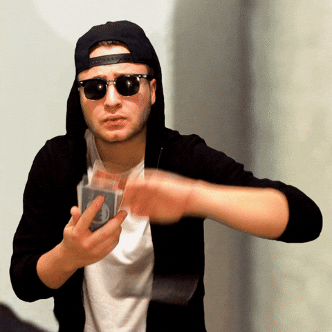 Man In Hoodie Tossing Monopoly Money GIF