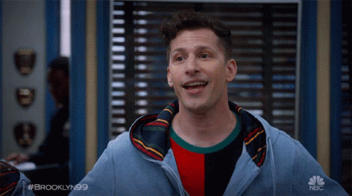 Man in Hoodie With NBC Logo