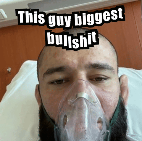 Man in Hospital Bed with Oxygen Mask