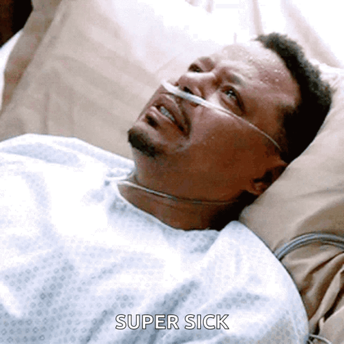Man in Hospital Bed with Oxygen Tube