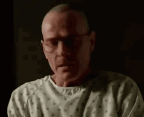 Man in Hospital Gown Crying