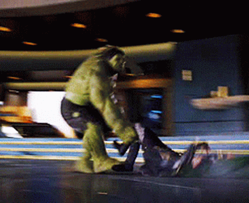 Man in Hulk Costume Standing Next to Man in Suit