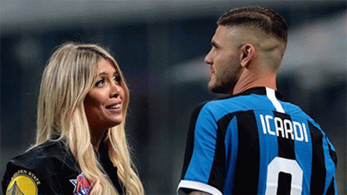 Man in Icardi Jersey Next to Woman in Warriors Shirt