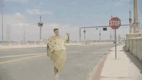 Man In Ice Cream Cone Costume And Dinosaur GIF