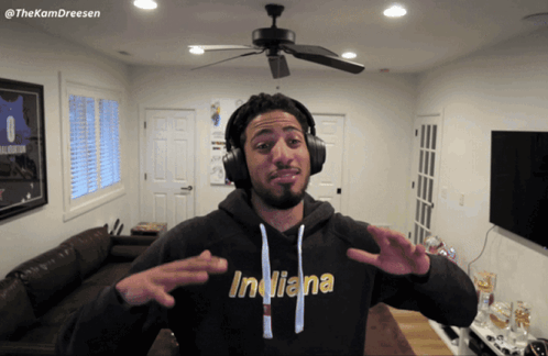 Man In Indiana Hoodie And Headphones GIF