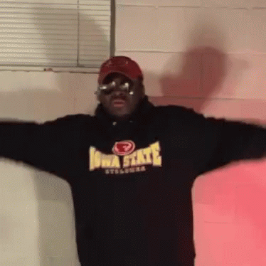 Man in Iowa State Sweatshirt Arms Outstretched