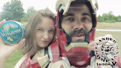 Man in Iron Man Costume Holding Can of Vosgienne