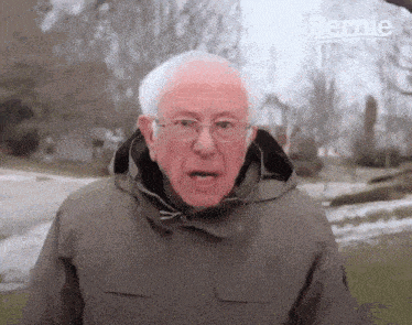 Man In Jacket And Glasses Making Funny Face GIF