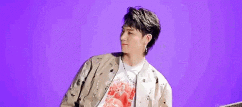 Man in Jacket and Red Shirt on Purple