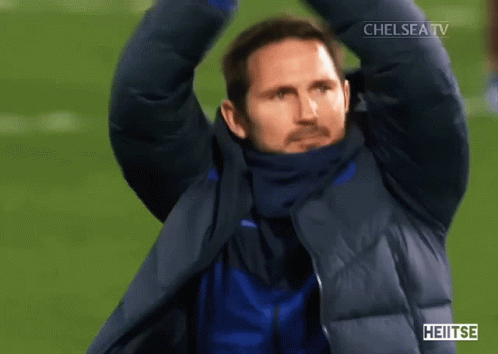 Man In Jacket In Front Of Crowd With Chelsea GIF