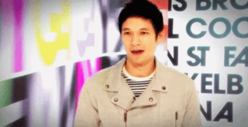 Man In Jacket In Front Of Elb Na Sign GIF