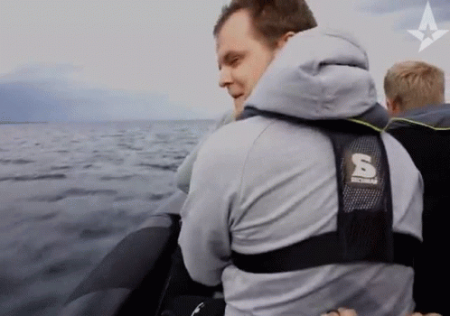 Man In Jacket With Letter S On Back GIF