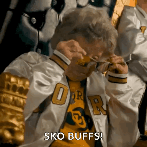 Man in Jacket With R Taking Off Glasses Saying Sko Buffs