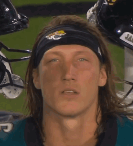 Man in Jaguars Headband Covering Mouth