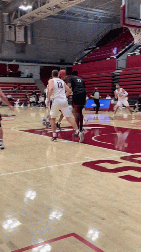 Man in Jersey 24 Holding Basketball