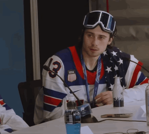 Man in Jersey Number 13 Sitting