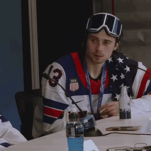 Man in Jersey Number 13 Sitting