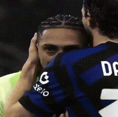 Man in Jersey Number 2 Hugging Another Man