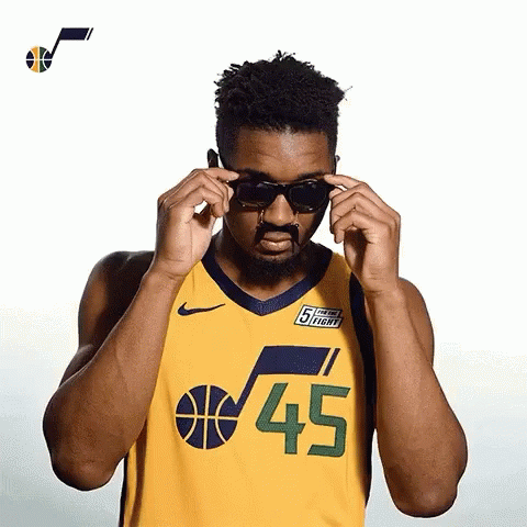 Man In Jersey Number 45 Adjusting Sunglasses GIF