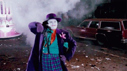 Man in Joker Costume Standing in Front of Car