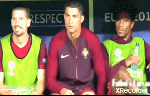Man in Kafd Shirt in Front of Men