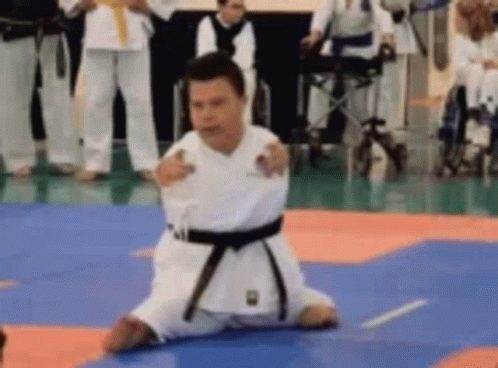 Man in Karate Uniform Kneeling