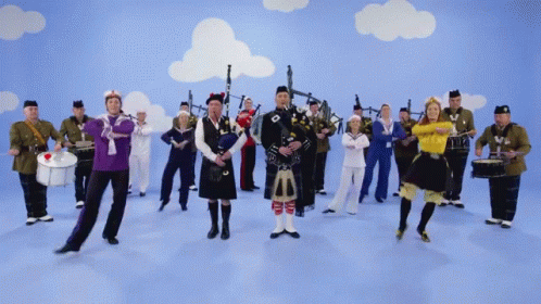 Man in Kilt Playing Bagpipe With Band