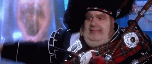 Man in Kilt Playing Bagpipe