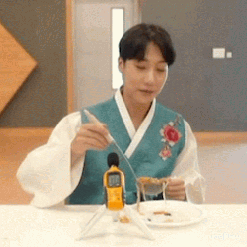 Man In Kimono With Plate Of Food GIF