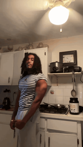 Man in Kitchen Holding Knife and Protein