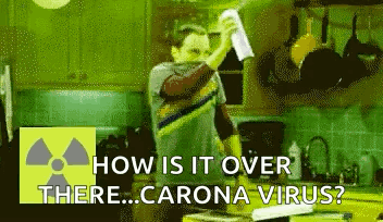 Man In Kitchen Holding Paper Asking How Is It Over There Corona Virus GIF