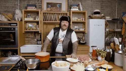 Man in Kitchen Wearing T-Shirt That Says I Love Italy