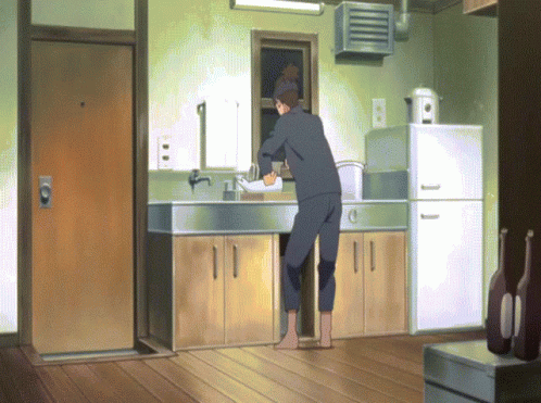 Man in Kitchen With Beer on Floor