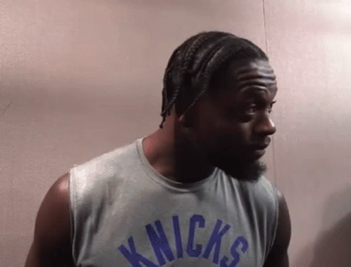 Man in Knicks Jersey Looking Left