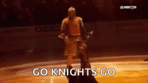 Man In Knight Costume On Ice Rink GIF