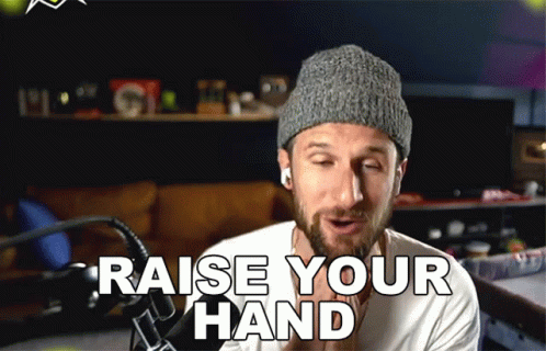 Man in Knitted Hat Saying Raise Your Hand