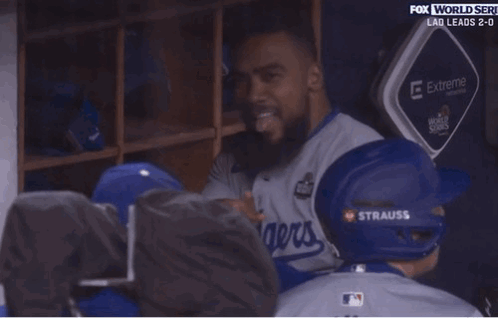 Man in La Baseball Helmet Sitting