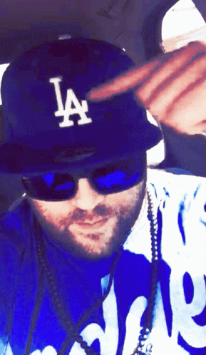 Man in LA Hat and Sunglasses
