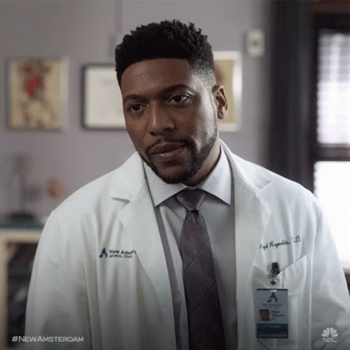 Man In Lab Coat And Tie With Newamsterdam Name Tag GIF