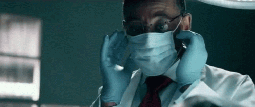 Man In Lab Coat And Tie With Surgical Mask And Gloves GIF