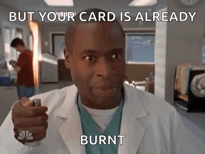 Man in Lab Coat Holding Lighter