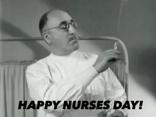 Man in Lab Coat Holding Syringe Happy Nurses Day