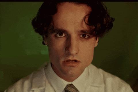 Man in Lab Coat Making Sad Face