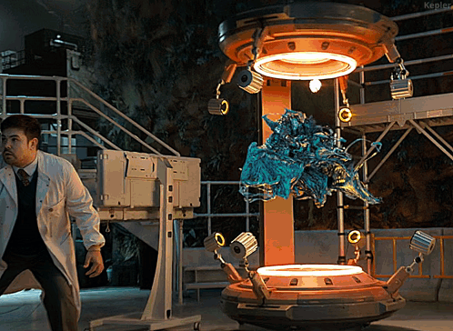 Man In Lab Coat Standing In Front Of Kepler Machine GIF